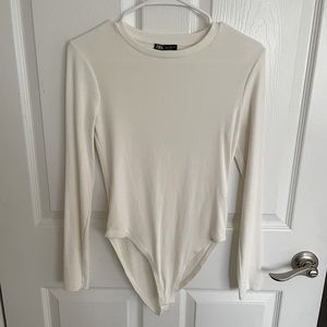 BRAND NEW ZARA bodysuit with round neck and long sleeves.